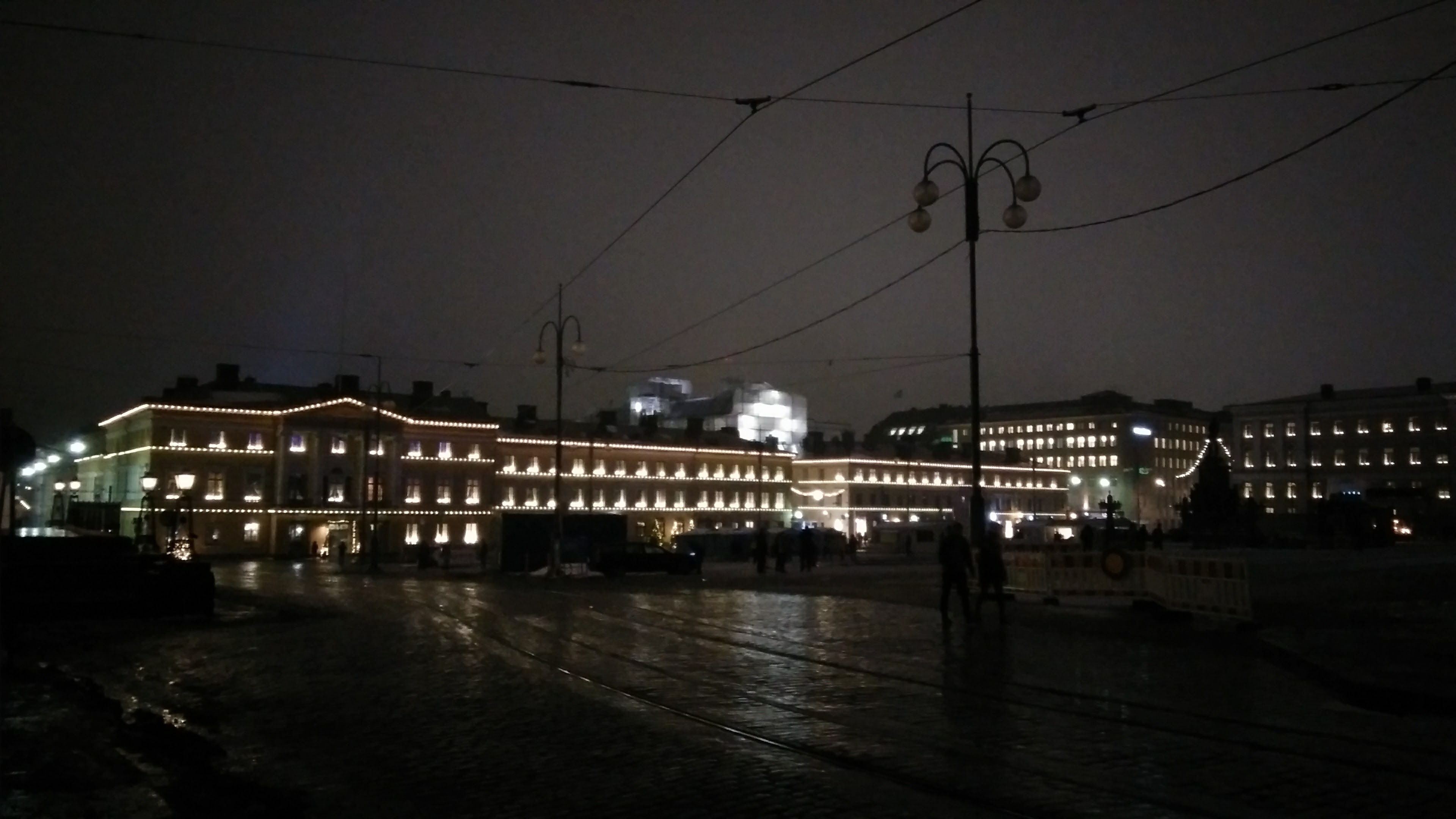 Lighted house behind a dark Senate Square